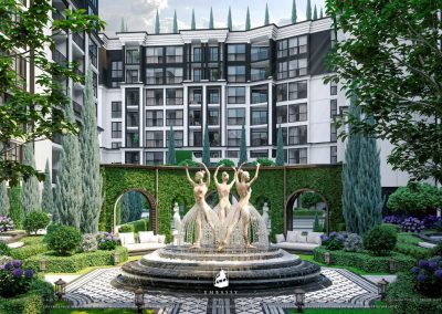 Elegant modern residential complex with fountain and lush greenery in Thailand.