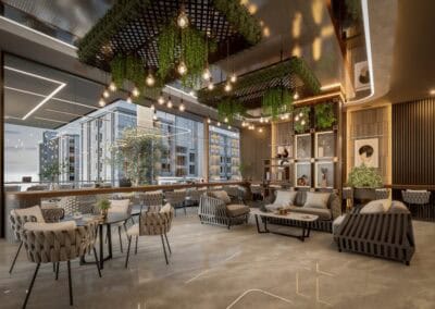 Modern hotel lobby with stylish furniture, greenery, and warm lighting.