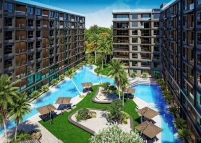 Modern hotel complex with pool, palm trees, and garden in Siamiq, Thajsko.